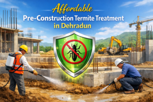 Affordable Pre Construction Termite Treatment Near Me in Dehradun – workers applying anti-termite chemical treatment to building foundation at a construction site with protective shield icon symbolizing termite protection